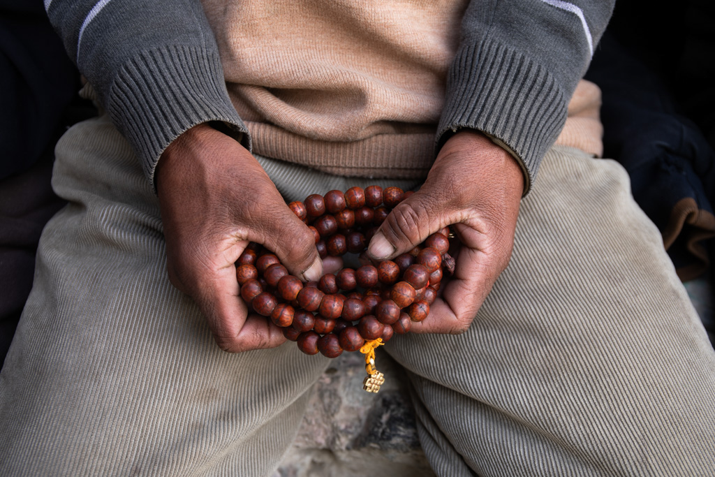 Hands that hold a necklace